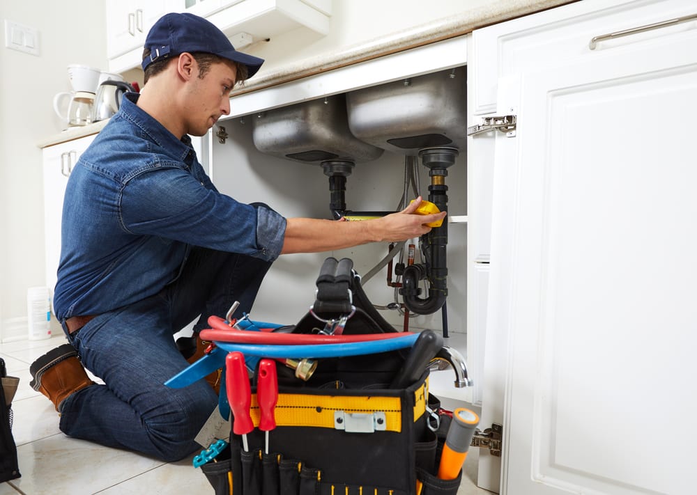 Plumber under sink